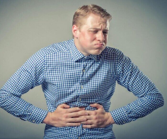 Abdominal pain and nausea due to parasites in the body.
